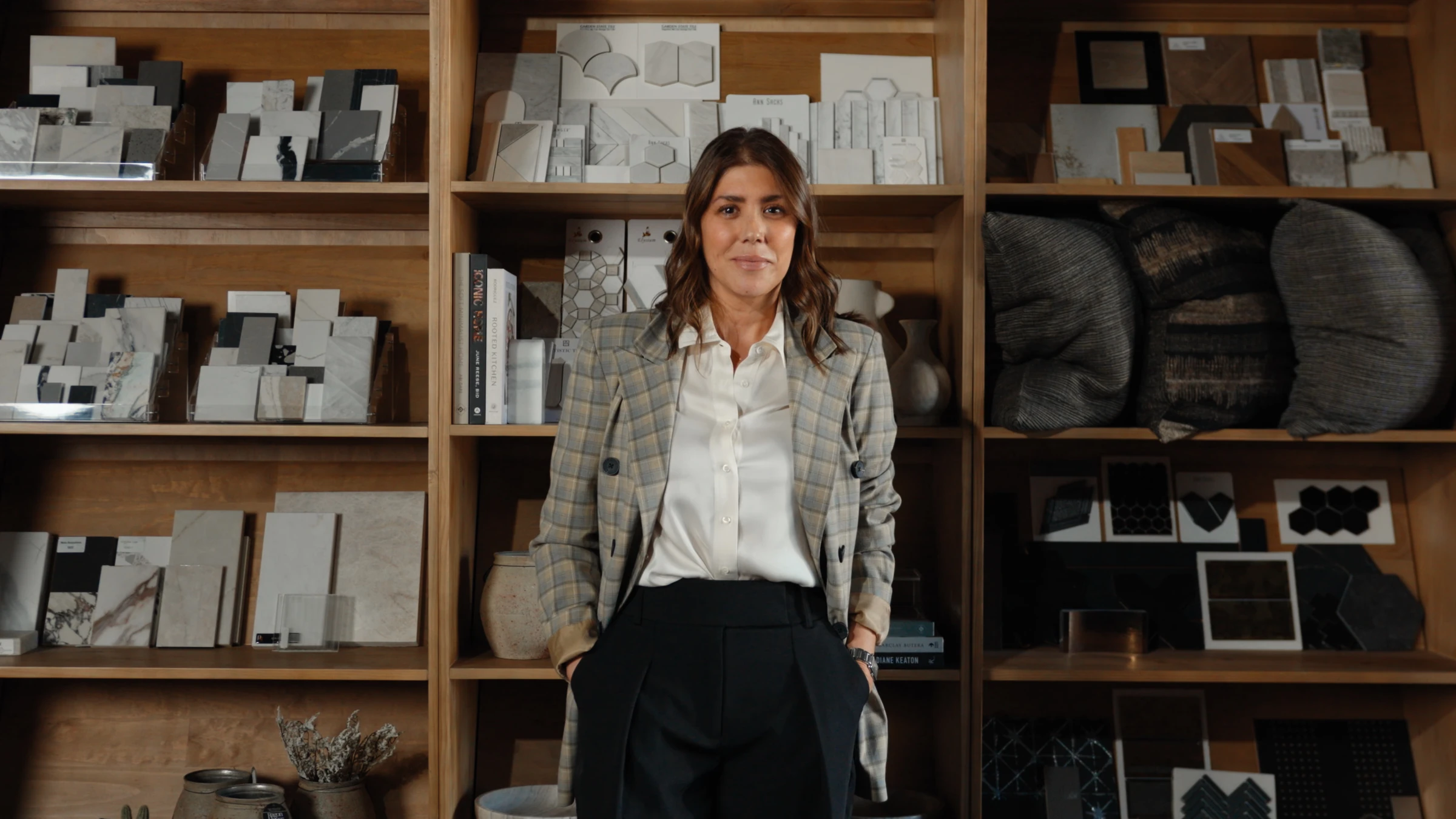 Woman in a plaid blazer standing in a materials showroom